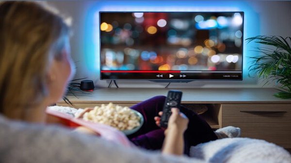 Write a dialogue between two friends about watching TV